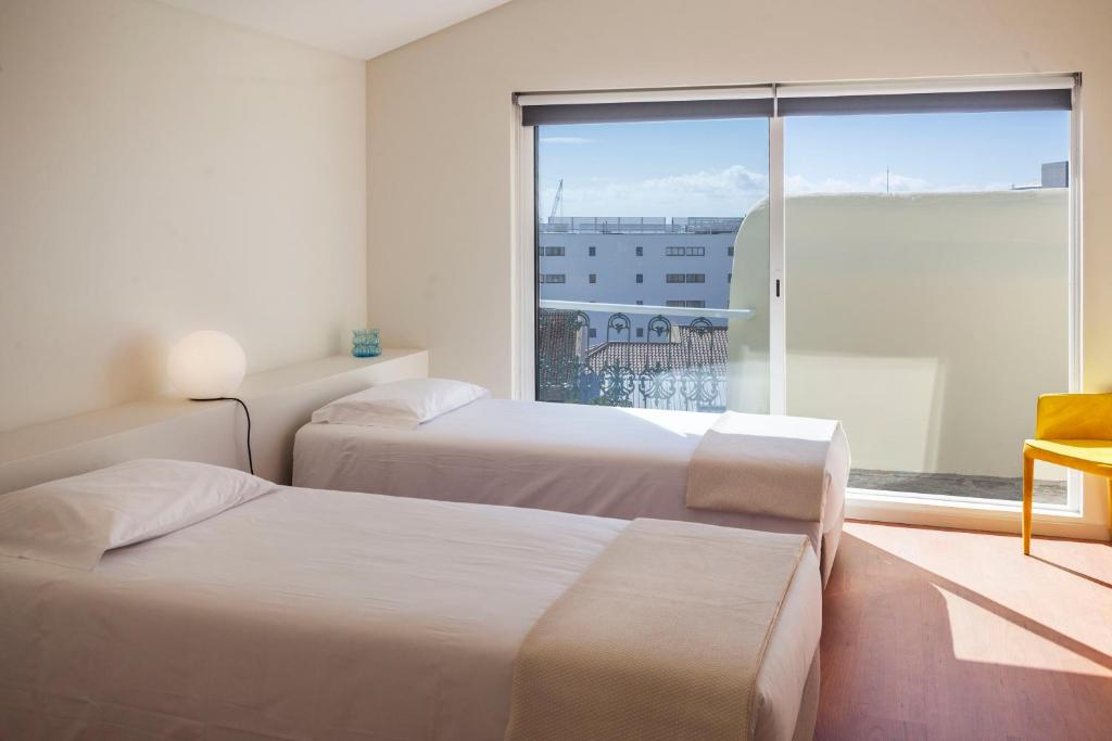 Postel nebo postele na pokoji v ubytování A Bica Hostel