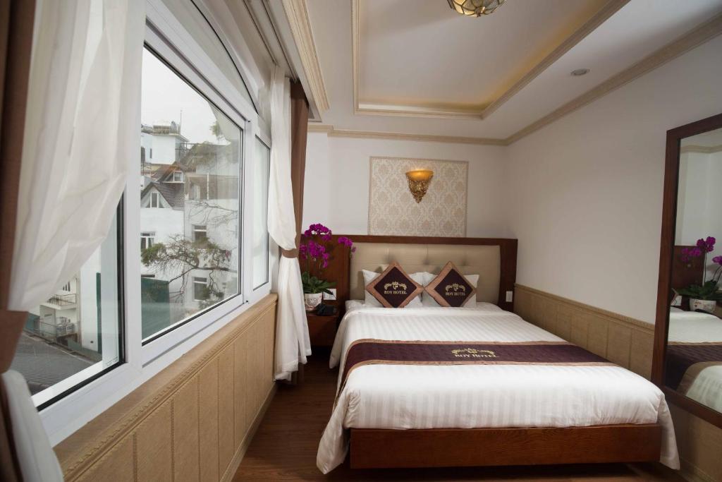 Postel nebo postele na pokoji v ubytování Roy Dala Hotel