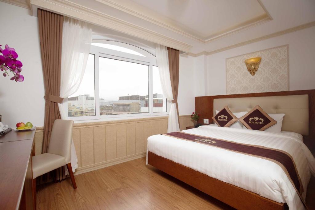 Postel nebo postele na pokoji v ubytování Roy Dala Hotel