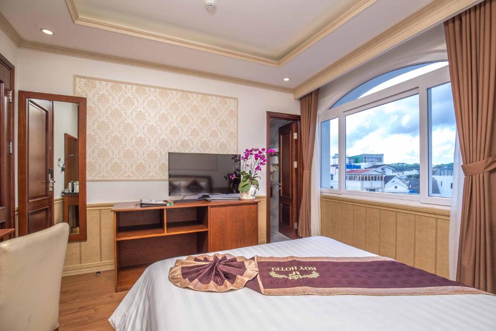 Postel nebo postele na pokoji v ubytování Roy Dala Hotel