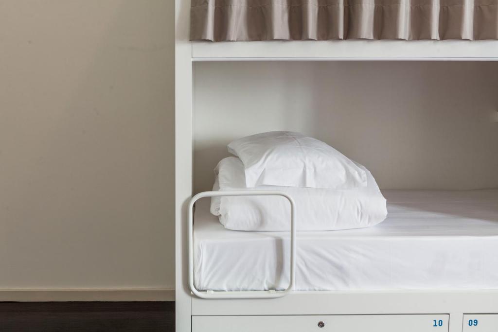 Postel nebo postele na pokoji v ubytování A Bica Hostel