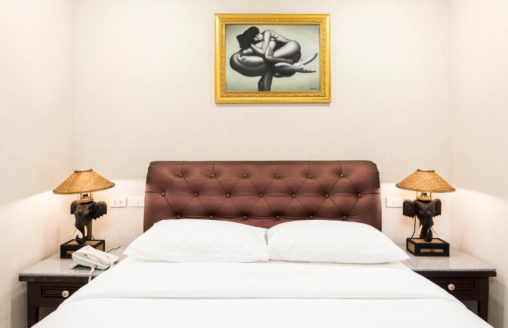 Postel nebo postele na pokoji v ubytování The Ambiance Hotel