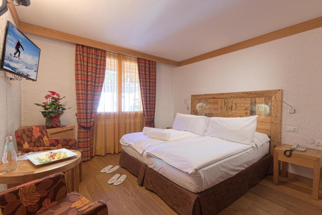 Postel nebo postele na pokoji v ubytování Style Hotel Grifone