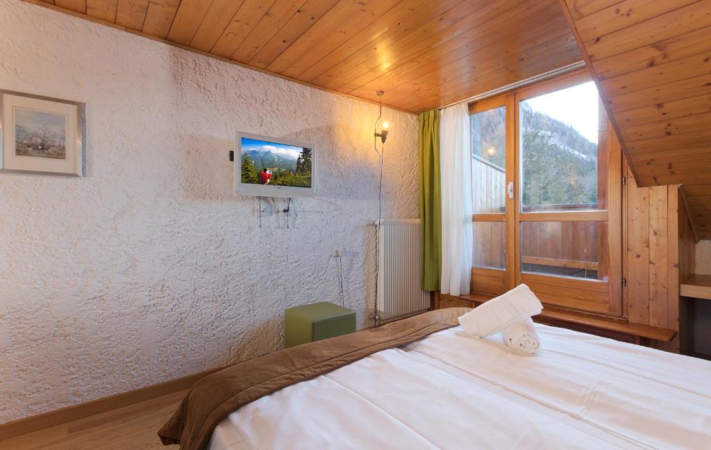 Postel nebo postele na pokoji v ubytování Style Hotel Grifone