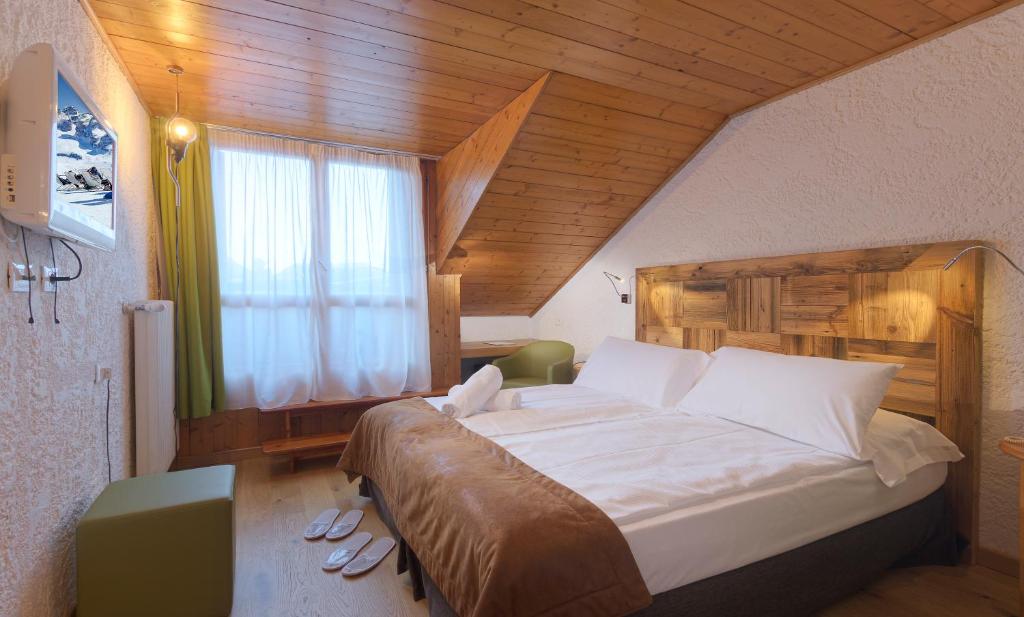 Postel nebo postele na pokoji v ubytování Style Hotel Grifone