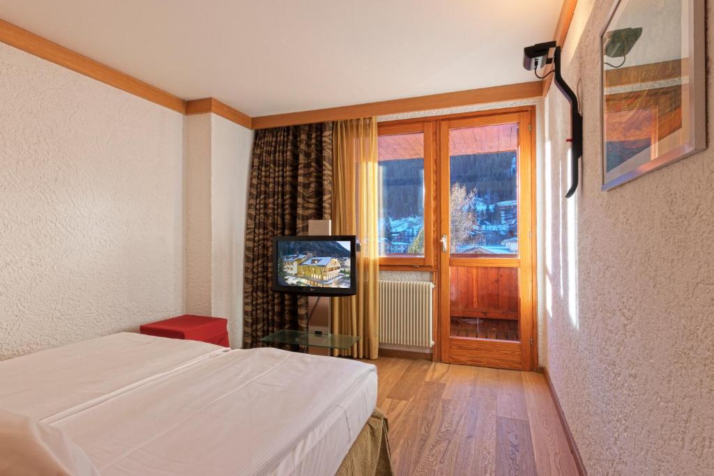 TV a/nebo společenská místnost v ubytování Style Hotel Grifone