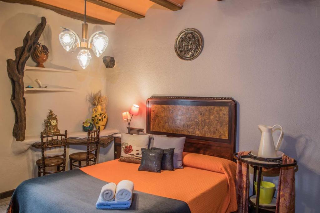 Postel nebo postele na pokoji v ubytování Casa Rural tía Salomé