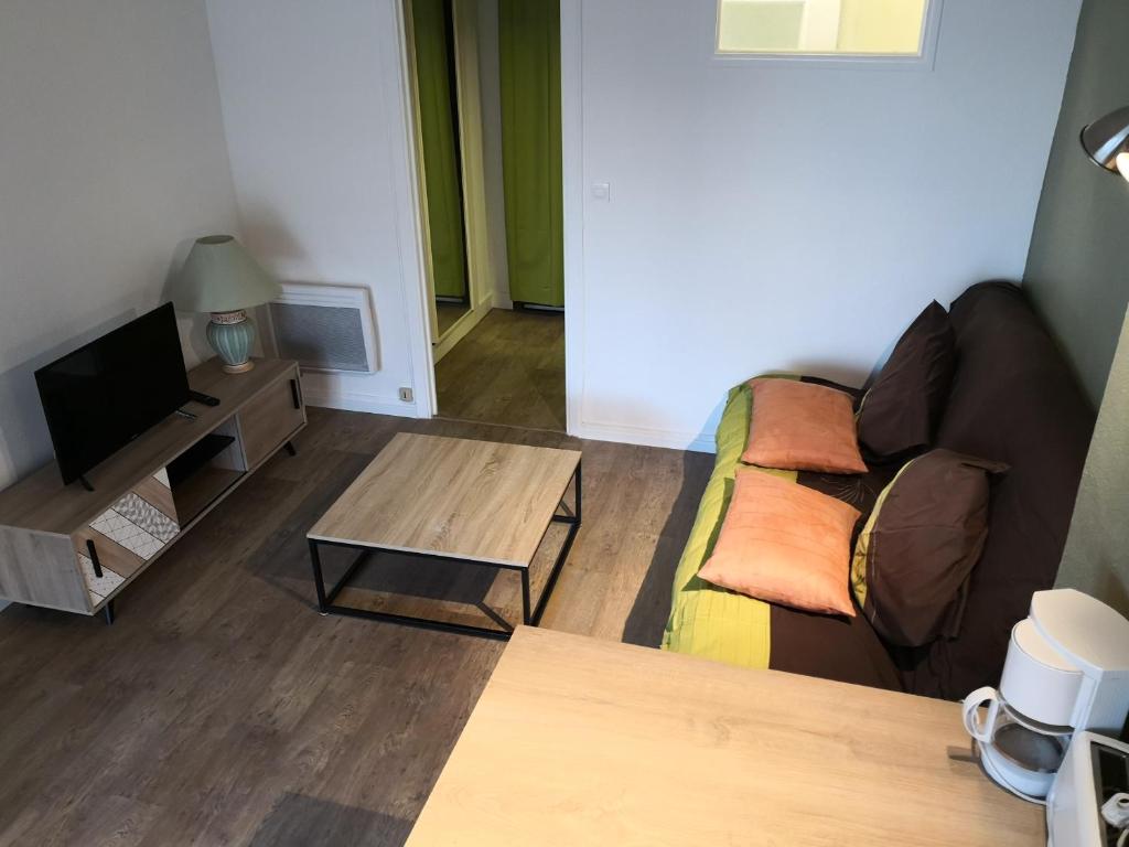 a living room with a couch and a coffee table at Apartment Cannes Croisette in Cannes