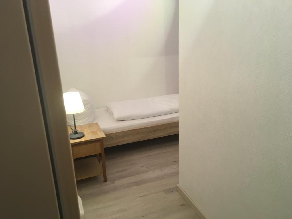 Postel nebo postele na pokoji v ubytování Hotel-Pension zum Paradies