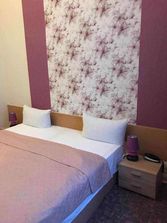Postel nebo postele na pokoji v ubytování Hotel Castell am Kurfürstendamm