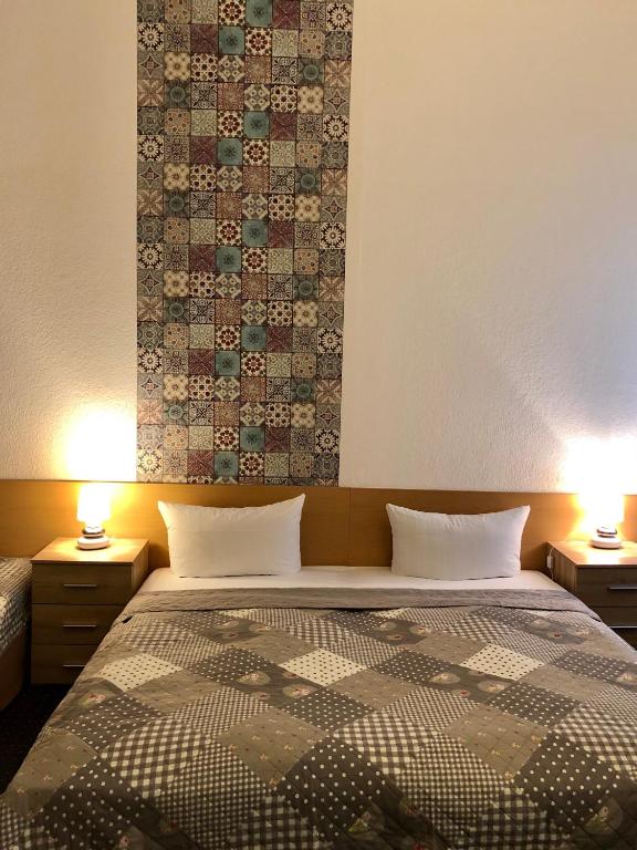 Postel nebo postele na pokoji v ubytování Hotel Castell am Kurfürstendamm