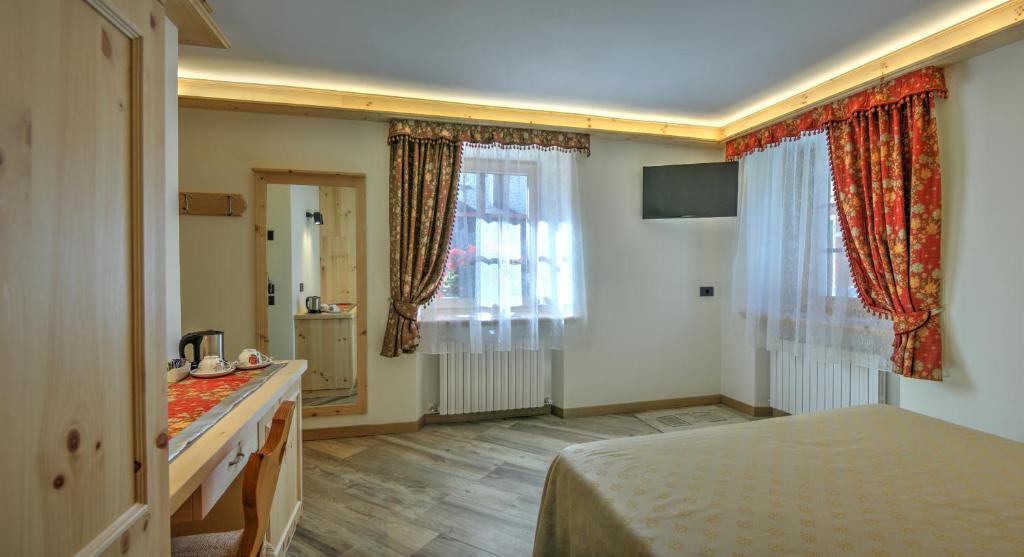 Postel nebo postele na pokoji v ubytování Hotel Federia