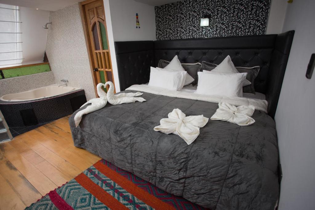 Postel nebo postele na pokoji v ubytování Hotel Inka King