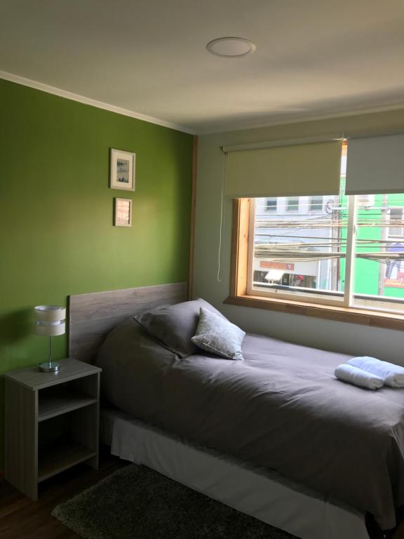 Llit o llits en una habitació de APART HOTEL SUVERAL