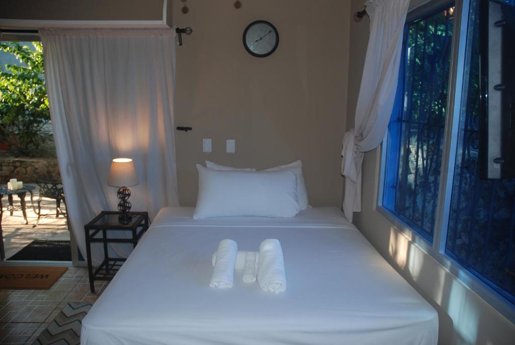 Postel nebo postele na pokoji v ubytování E&J Boutique Residences