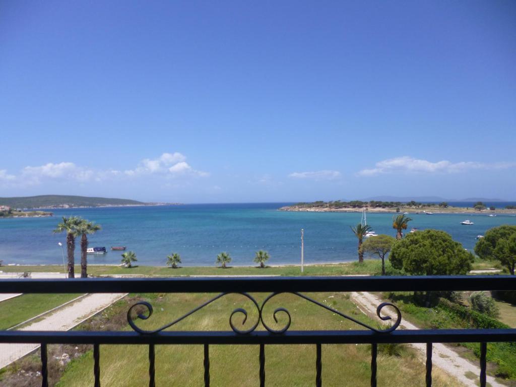 a view of the ocean from a balcony at Albayrak Hotel in Çeşme