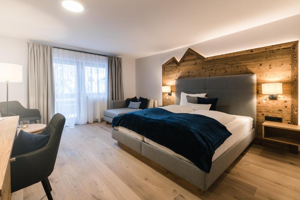 Postel nebo postele na pokoji v ubytování meiZeit Lodge