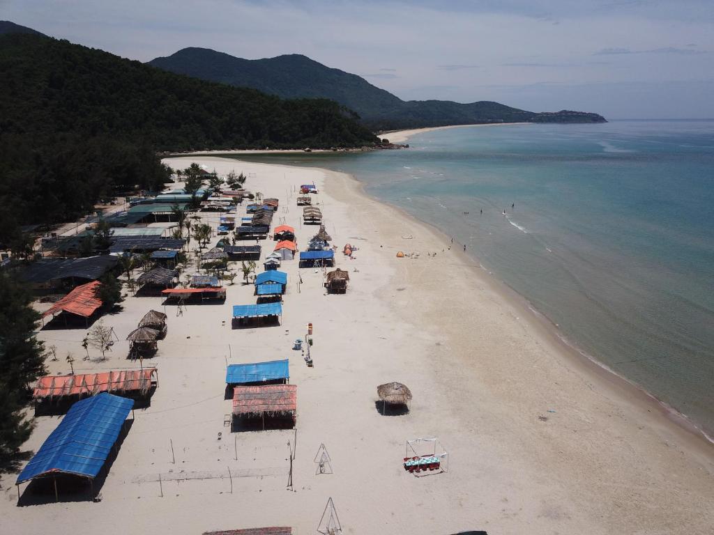 an aerial view of a beach with a group of boats at CANH DUONG MOTEL in Lang Co