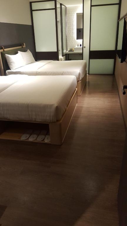 Postel nebo postele na pokoji v ubytování City Suites - Main Station