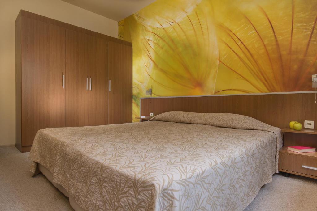 Postel nebo postele na pokoji v ubytování Effect Malina Residence Hotel