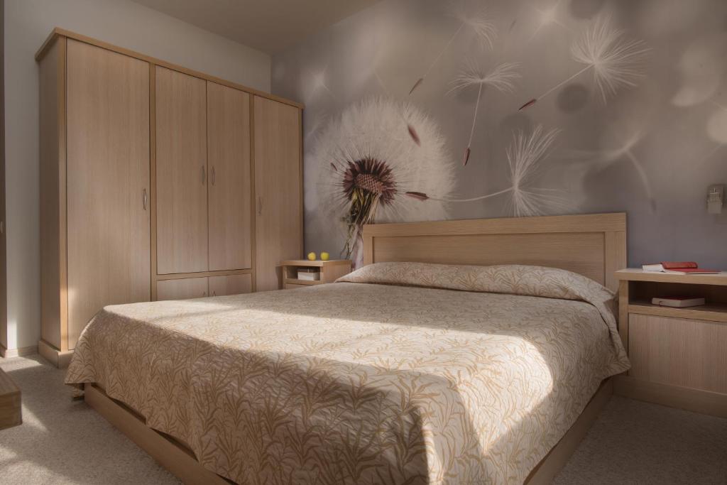 Postel nebo postele na pokoji v ubytování Effect Malina Residence Hotel