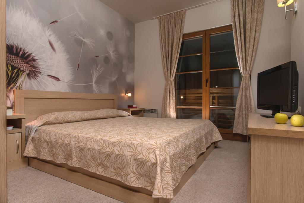 Postel nebo postele na pokoji v ubytování Effect Malina Residence Hotel