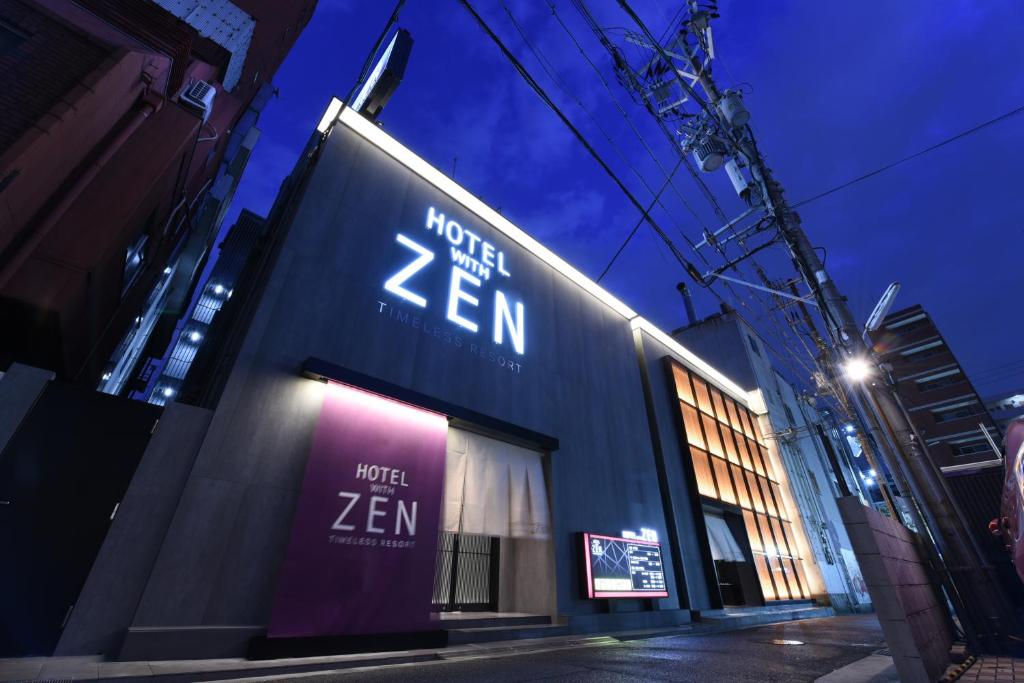 a store with a sign on the side of a building at Hotel ZEN Sennichimae (Adult Only) in Osaka