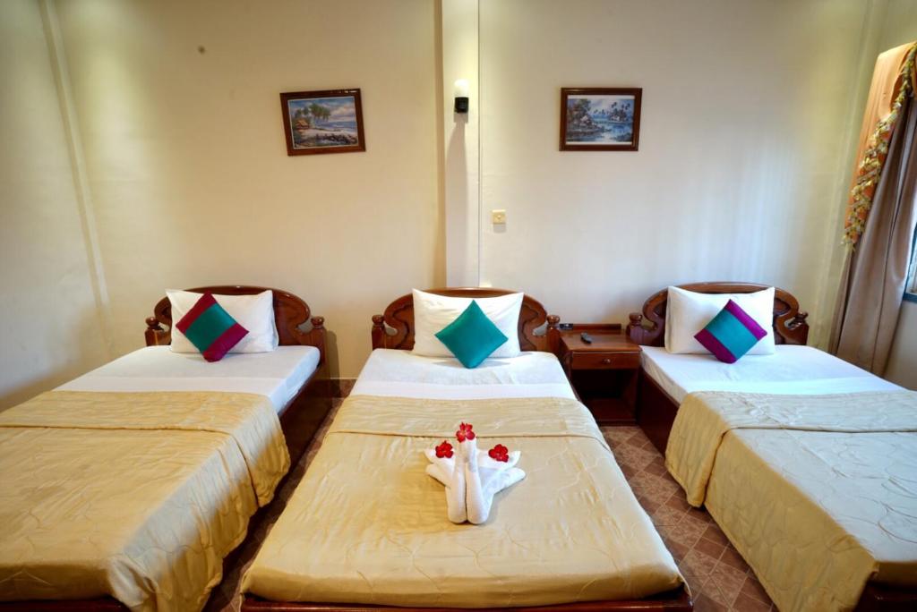 Postel nebo postele na pokoji v ubytování Royal Hotel