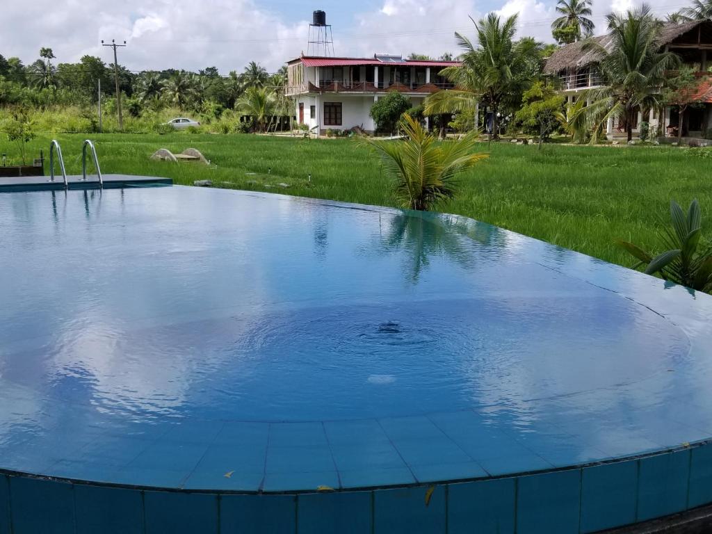 Bazén v ubytování Nelu Villa Sigiriya nebo v jeho okolí