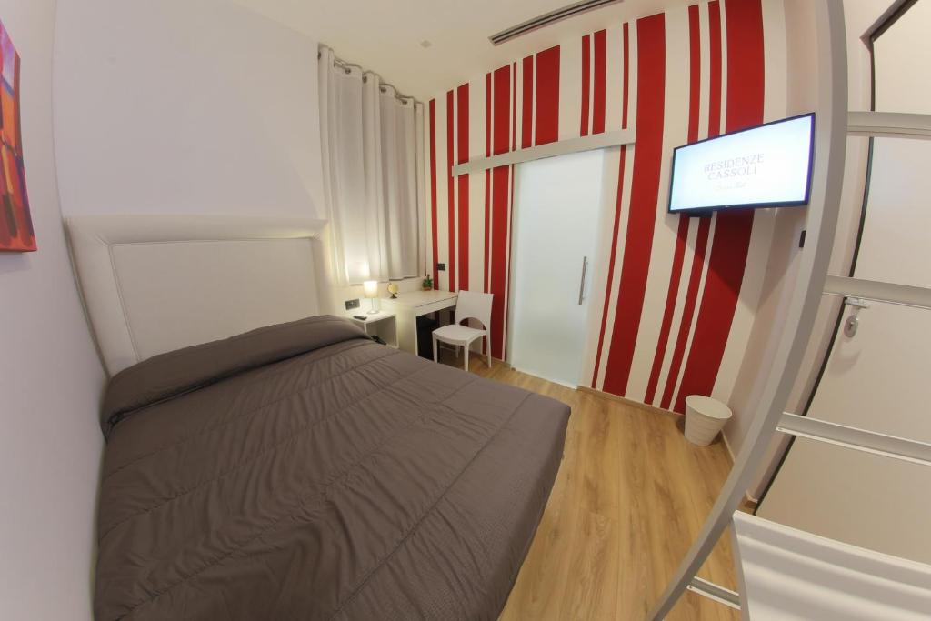 Postel nebo postele na pokoji v ubytování RESIDENZE CASSOLI - Lamezia Centro