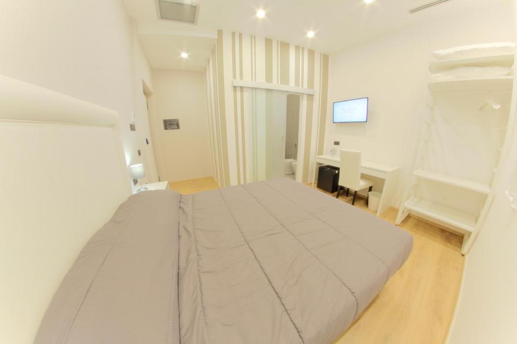Postel nebo postele na pokoji v ubytování RESIDENZE CASSOLI - Lamezia Centro