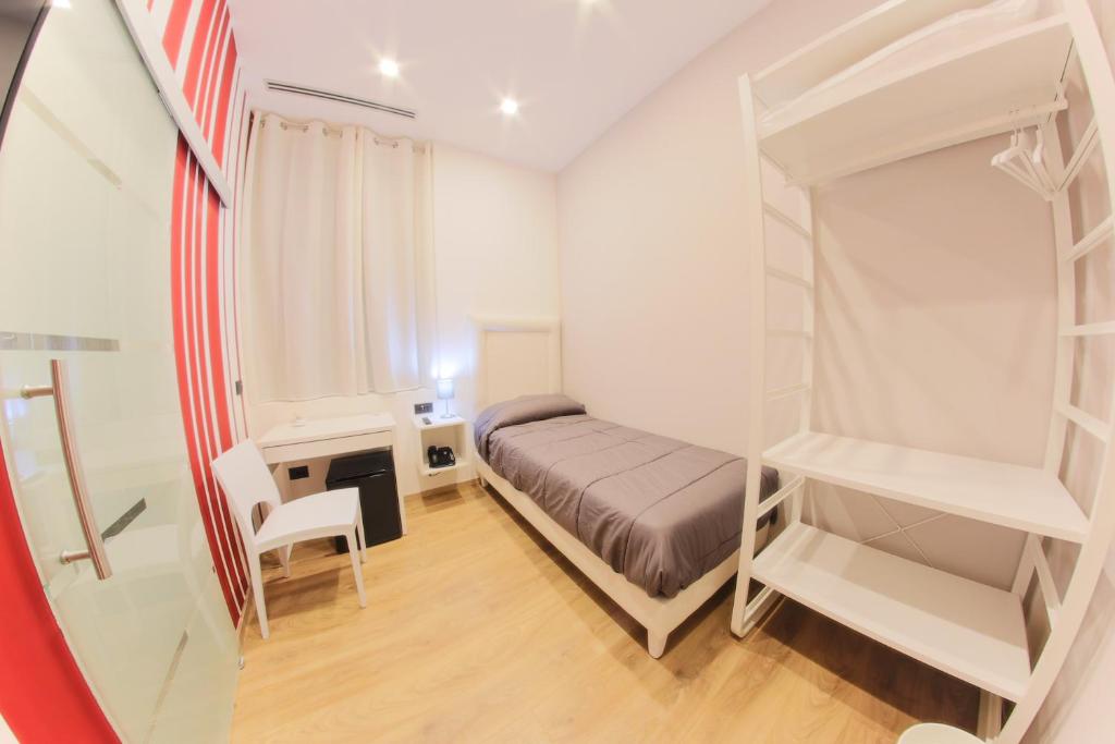 Postel nebo postele na pokoji v ubytování RESIDENZE CASSOLI - Lamezia Centro