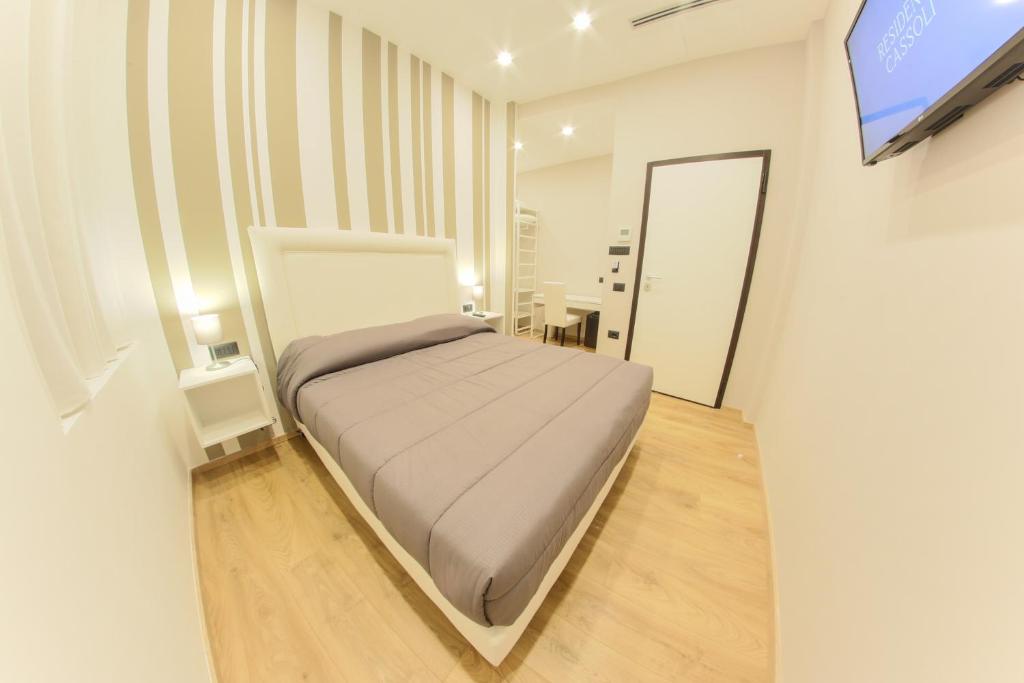 Postel nebo postele na pokoji v ubytování RESIDENZE CASSOLI - Lamezia Centro