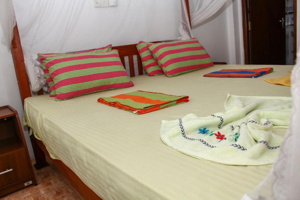 Postel nebo postele na pokoji v ubytování Resort Deepika Mirissa