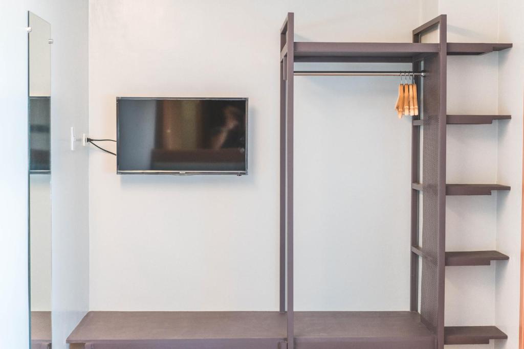 TV a/nebo společenská místnost v ubytování Henia Hotel