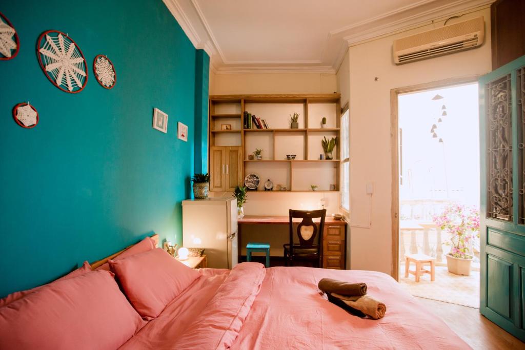 a bedroom with a bed with a stuffed animal on it at Kalon Homestay, Hai Bà Trưng, HN in Hanoi