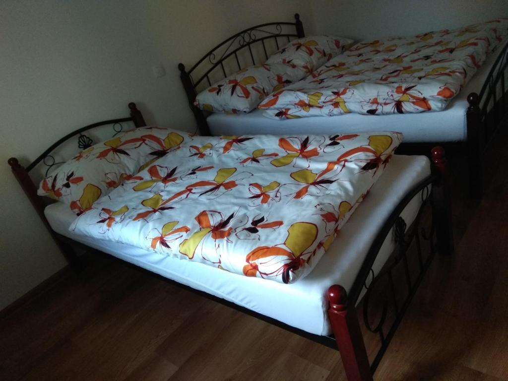 A bed or beds in a room at Apartmány Danka