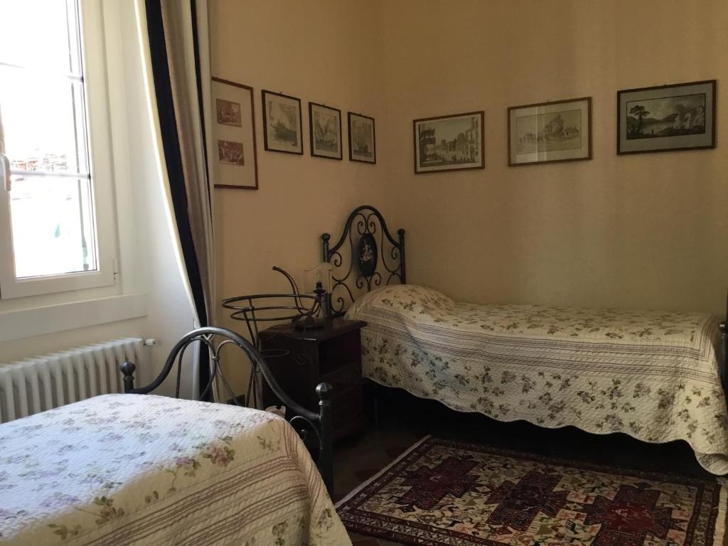 Łóżko lub łóżka w pokoju w obiekcie Casa Venezia