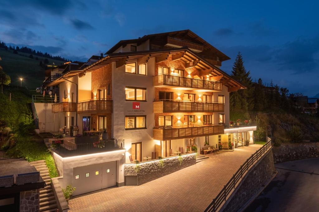 a large building with a lot of windows at Haus Melitta in Lech am Arlberg