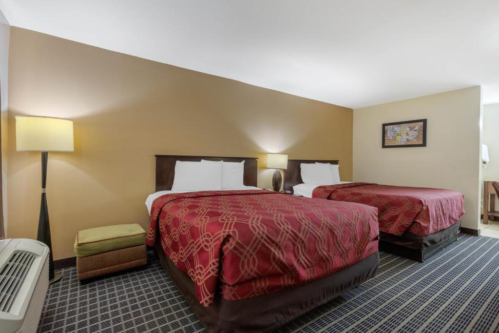 Postel nebo postele na pokoji v ubytování Econo Lodge