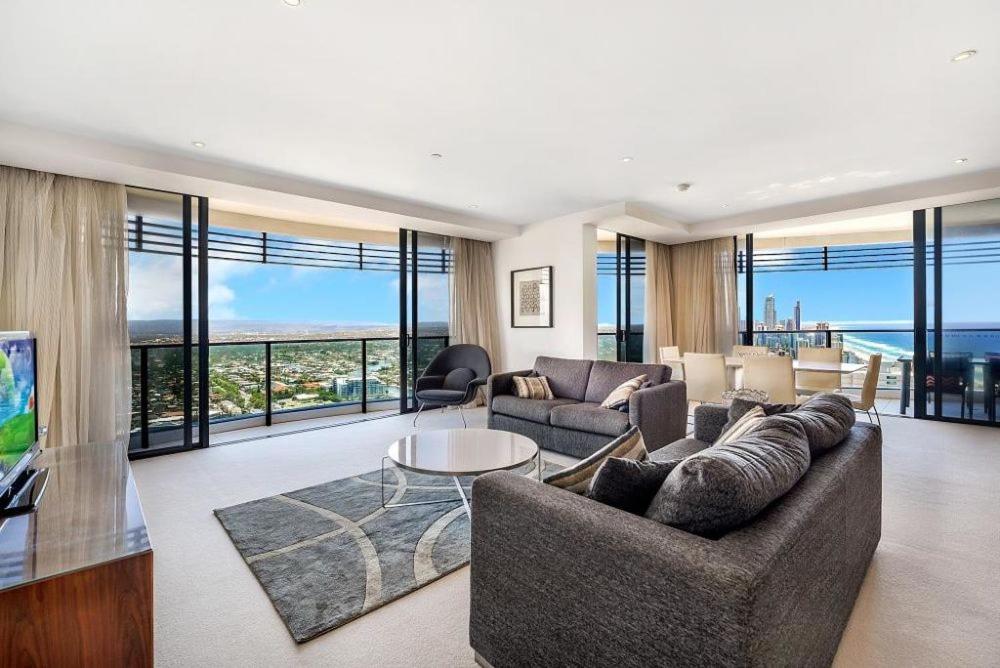 a living room with a couch and a table at Luxury 3 Bedroom in heart of Broadbeach in Gold Coast