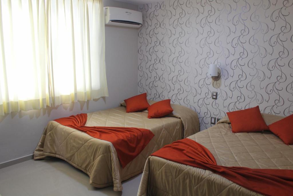 Postel nebo postele na pokoji v ubytování Suites San Luis
