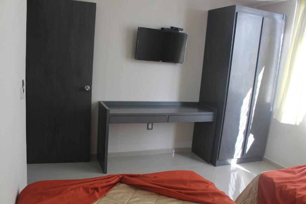 TV a/nebo společenská místnost v ubytování Suites San Luis