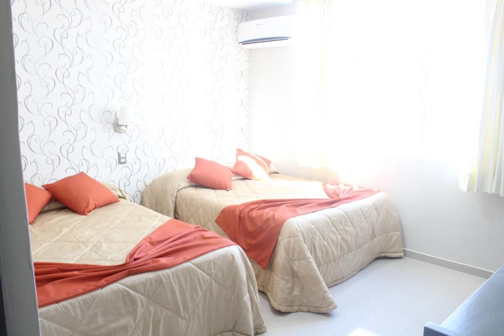 Postel nebo postele na pokoji v ubytování Suites San Luis