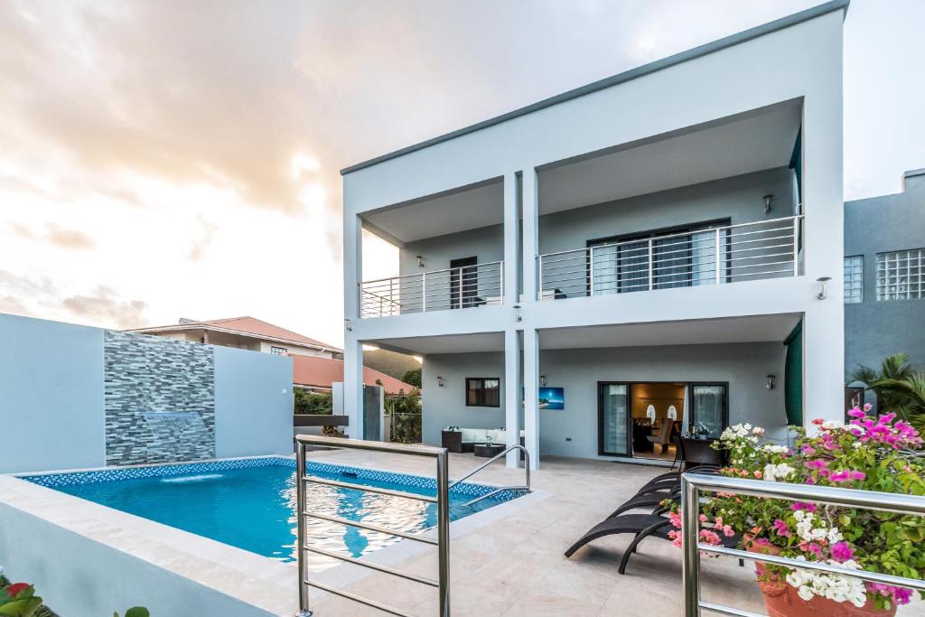 a view of a house with a swimming pool at Waters Edge Villas by Bay Gardens Resorts in Gros Islet