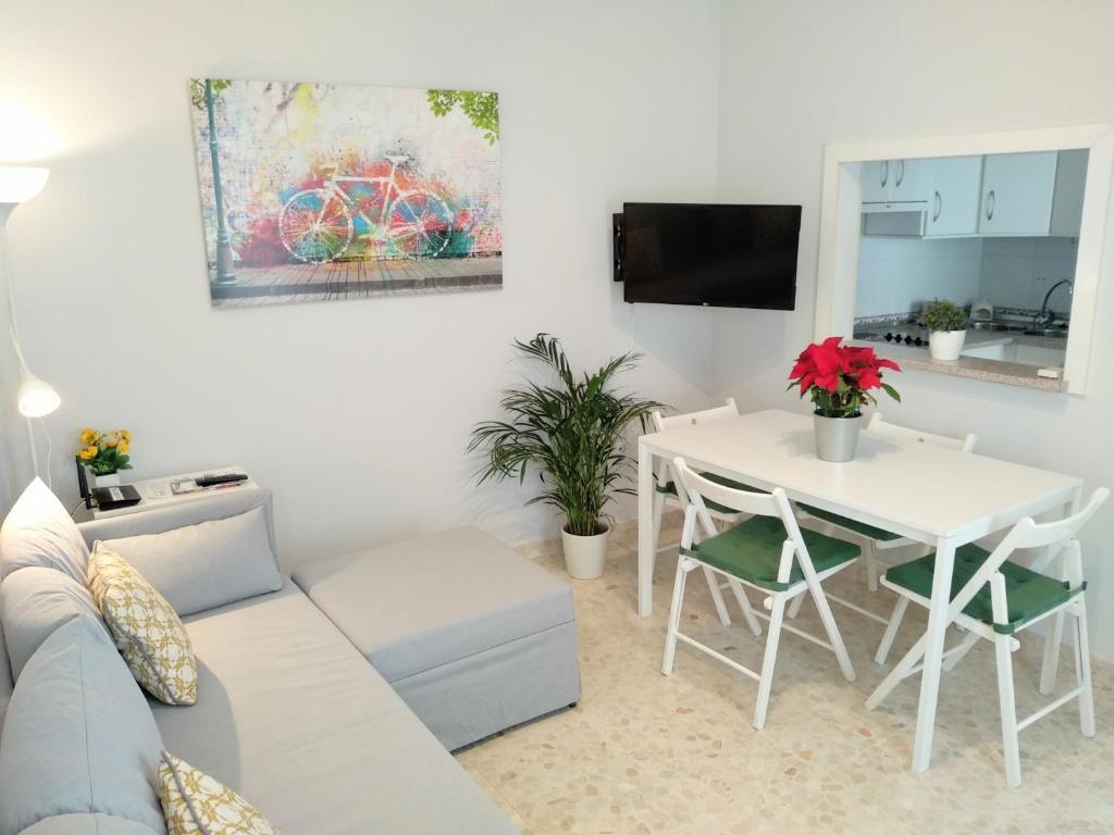 a living room with a couch and a table at Apartamento Maicandil in Ronda