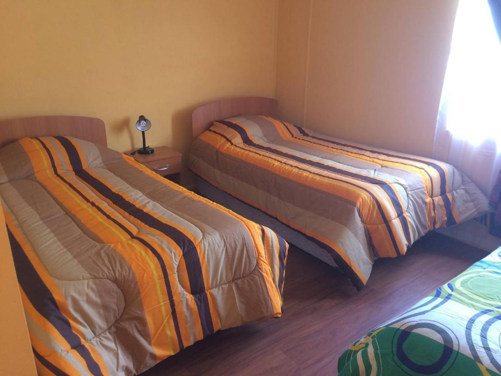 Postel nebo postele na pokoji v ubytování Cabañas ECA Cochrane