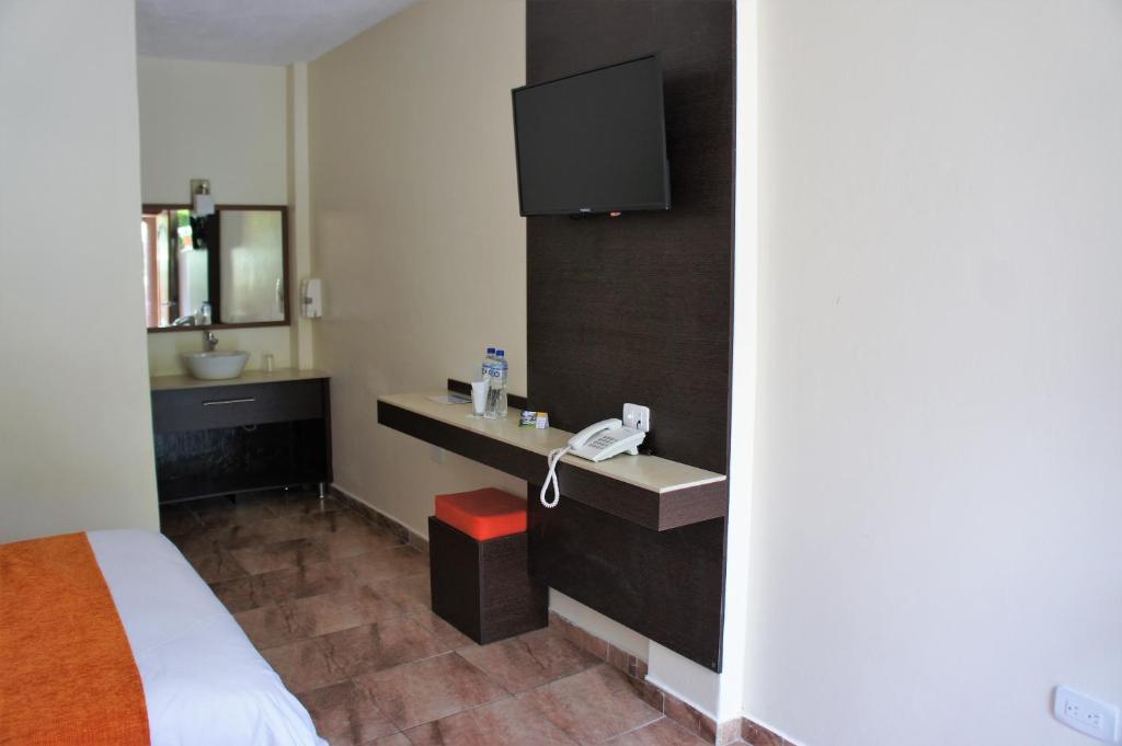 Postel nebo postele na pokoji v ubytování Monte Selva Hotel Spa Termal