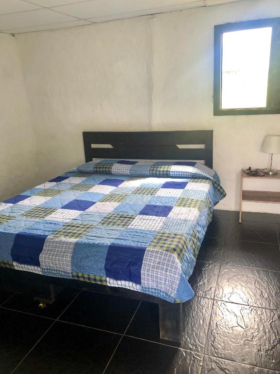 Postel nebo postele na pokoji v ubytování Finca Hotel Paraiso Urrao