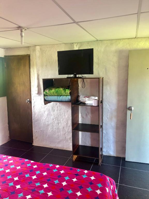 TV a/nebo společenská místnost v ubytování Finca Hotel Paraiso Urrao